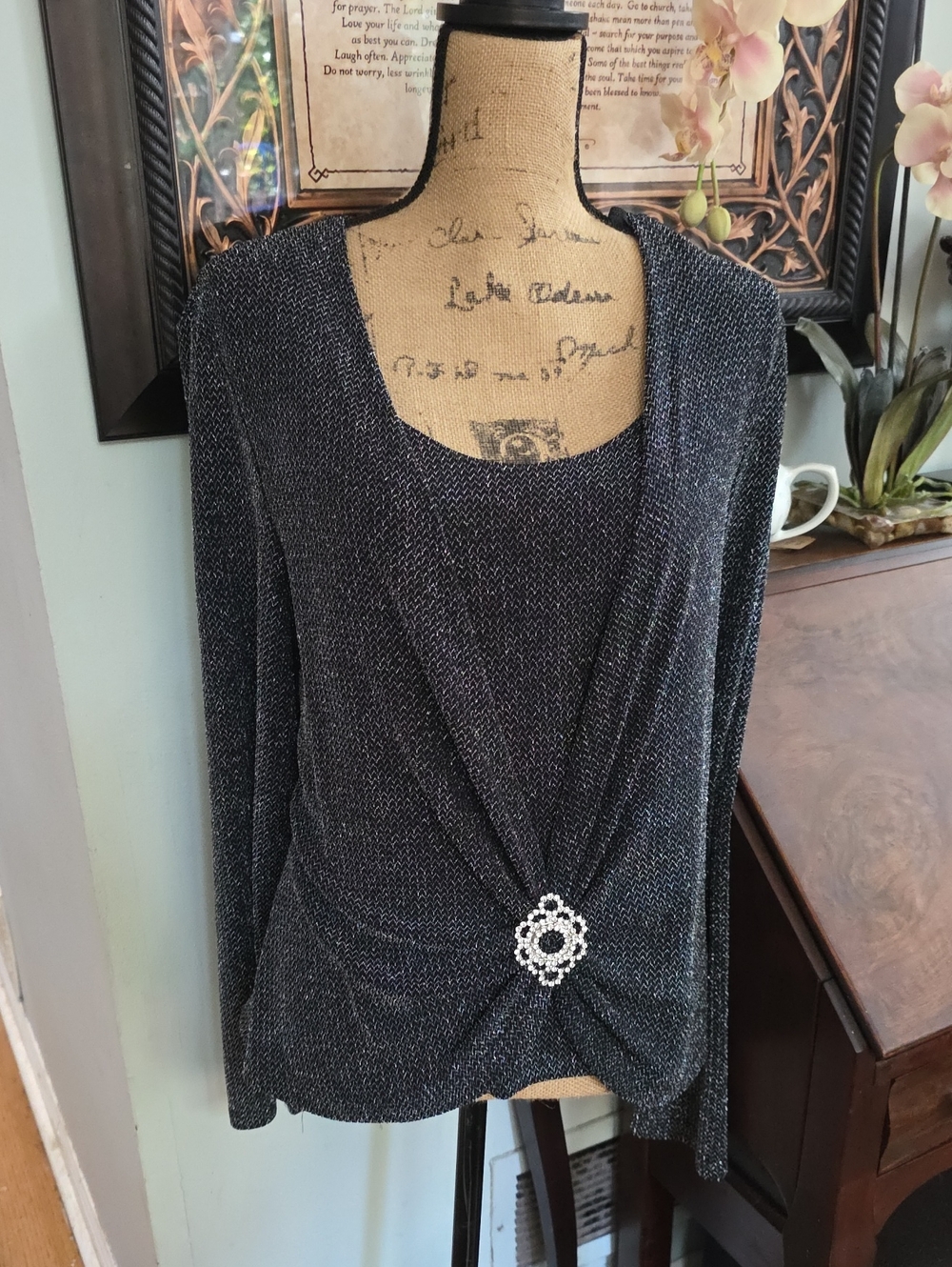 Metallic Black Women's Long-Sleeve Drape Front Top with Decorative Brooch